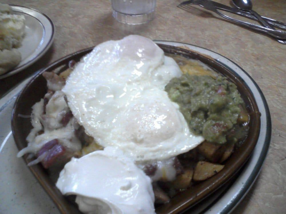 Chili Verde Skillet · Pork chili verde, melted cheddar, Jack cheese, sour cream, and guacamole. Made with our country potatoes, diced with peppers, onions, and including 2 eggs.
