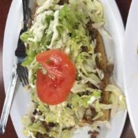 Huaraches · Lettuce, salsa, beans, onion and Cotija cheese. Choice of meat.