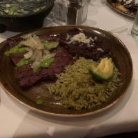 Carne Asada · Fire-charred skirt steak with chimichurri sauce, lime-marinated onions, avocado, black beans...