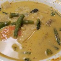 Green Curry · Coconut curry, eggplants, string beans, bell peppers, bamboo shoots and basil leaves. Served...