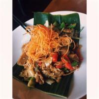 Pad Kee Mow · Flat rice noodles with chicken or beef stir fried with garlic, onion, bell peppers, chili an...