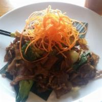 Pad See Iew · Wide rice noodles with a choice of chicken or beef with broccoli and Chinese broccoli.