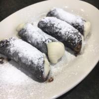 Cannoli · Fried pastry with a sweet creamy filling. 