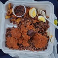 Waakye · Rice and beans. Served with either fish, goat, boiled egg and black sauce.