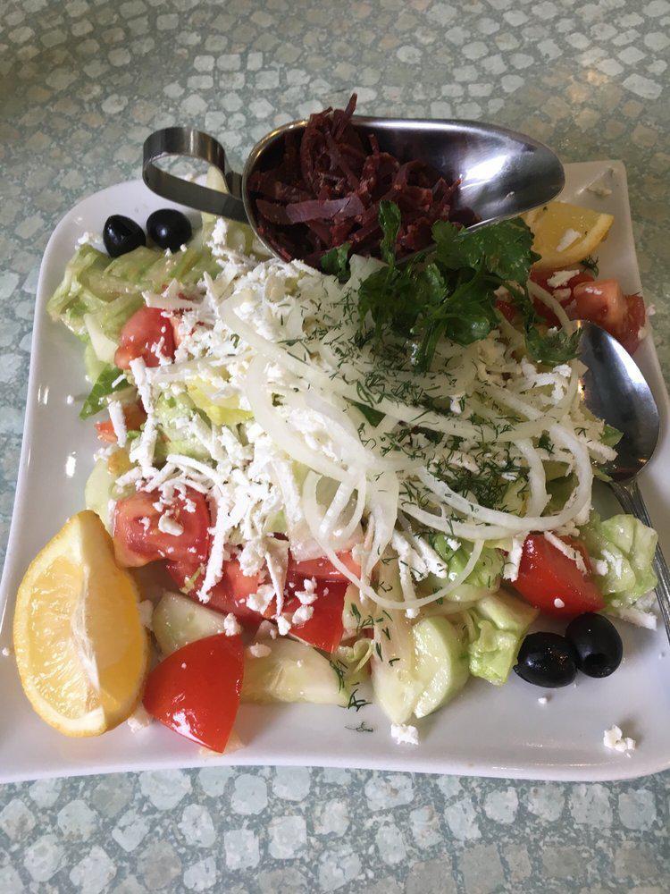 Greek Salad · Iceberg lettuce, tomatoes, cucumbers, onion and feta cheese with oil and vinegar. 