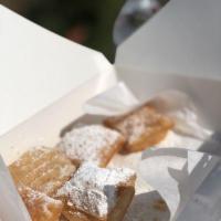 Beignets · A New Orleans style doughnut topped with powdered sugar