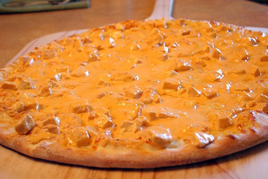 Buffalo Chicken Pizza · Fresh grilled chicken breast smothered with a blend of blue cheese and our signature hot wing sauce and complimented with mozzarella cheese.