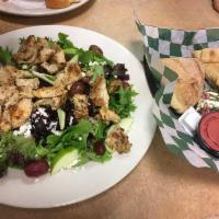 Apples and Goat Cheese Salad · Sliced green apples, crumbled goat cheese, dried cranberries and red grapes on a bed of chop...