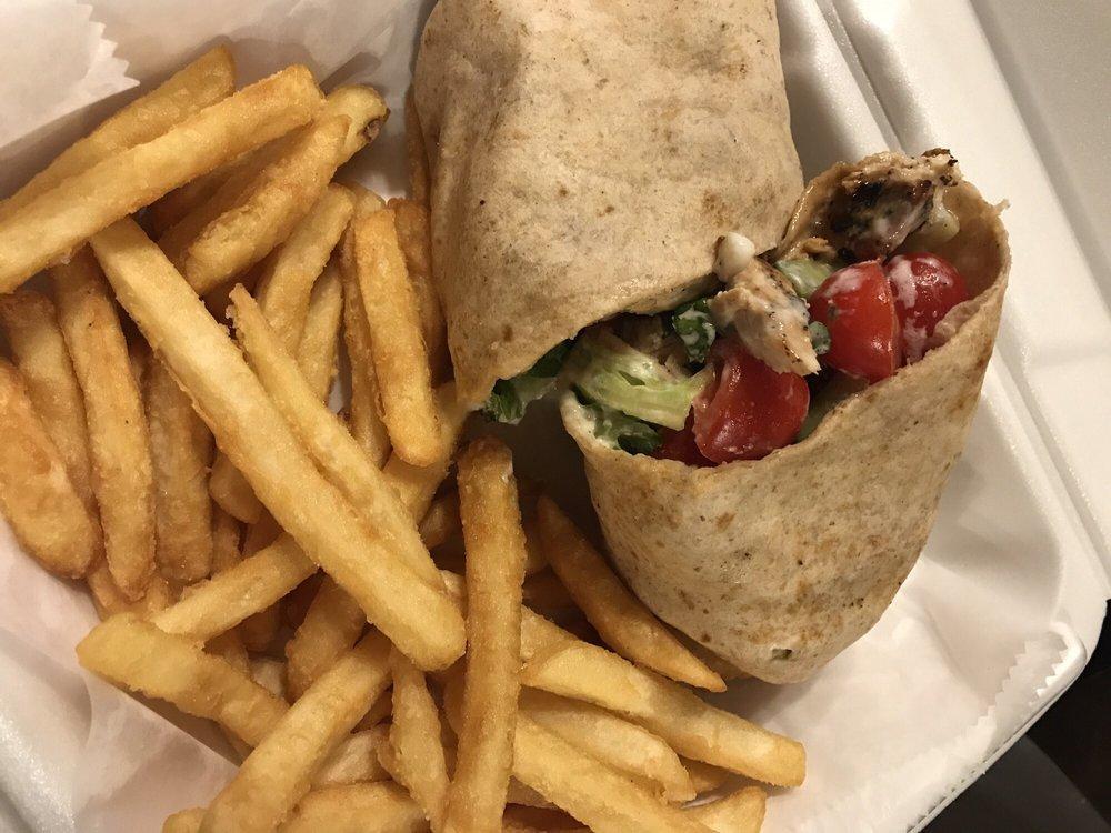 Chicken Tzatziki Wrap · Your choice of wrap filled with grilled chicken, sliced cucumbers & tomatoes, spring greens and our house-made tzatziki spread (Greek yogurt, cucumber and dill sauce). Served with french fries.