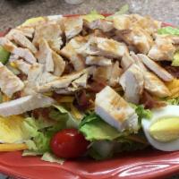 Cobb Salad · Romaine lettuce, cheddar cheese, cherry tomato, bacon, hard boiled egg and avocado. Served w...