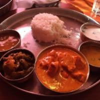 Chicken Makhani · Boneless chicken cooked in a butter sauce. Served with rice.