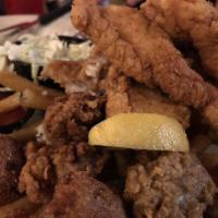 Fried Seafood Platter · Seasoned golden fried oysters, shrimp and crispy catfish piled high. Pair it with an abita b...