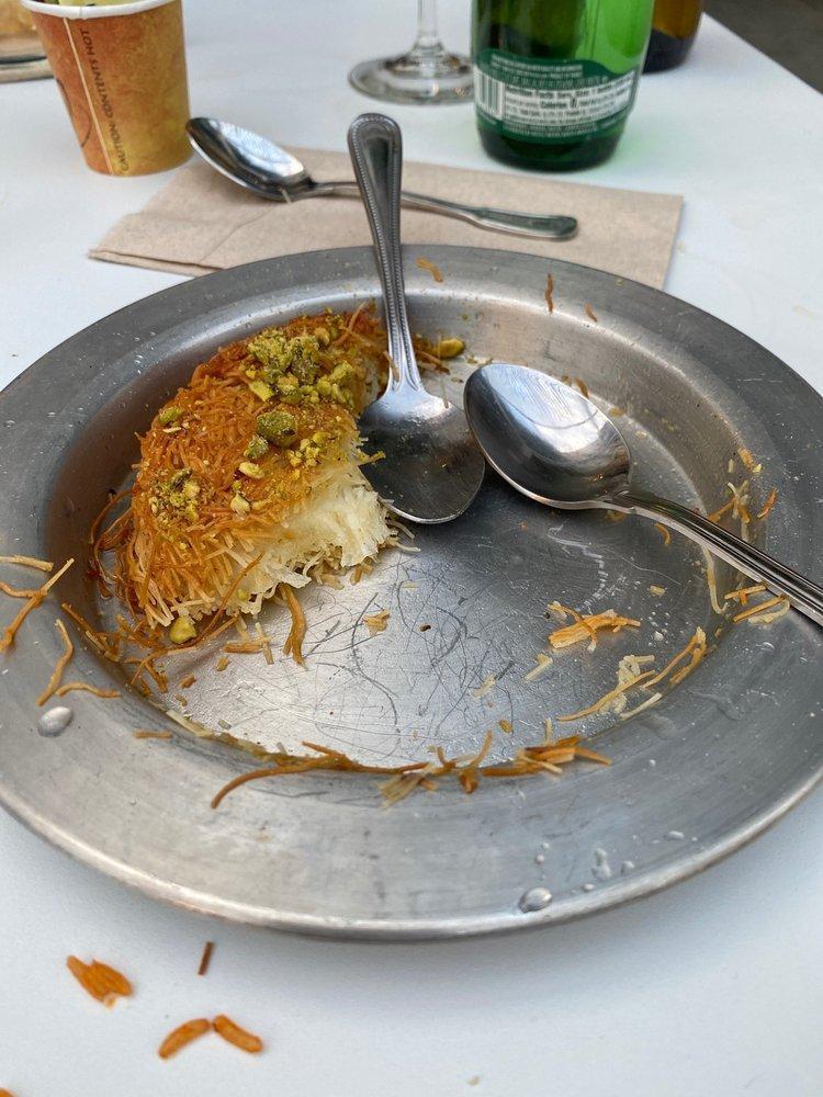 Kunefe · Crispy shredded phyllo dough filled with cheese and baked, then topped with simple syrup and pistachios.