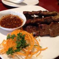 Moo Yang · 5 skewers. Our house famous grilled marinated pork or chicken on skewer with special homemad...