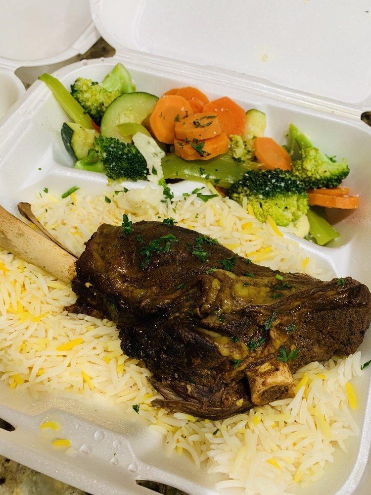 Lamb Shank · Tender lamb shank braised with Middle-Eastern spices. Served with basmati rice and sauteed vegetables. Gluten free and halal.
