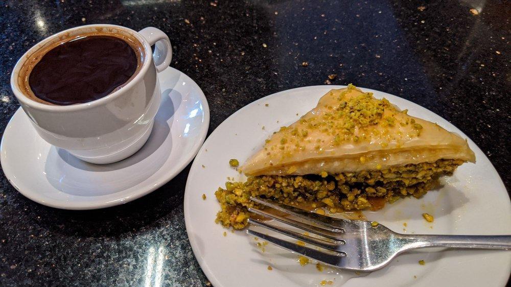 Baklava · Flaky thin layers of filo pastry, stuffed with chopped pistachios, topped with rose water syrup.