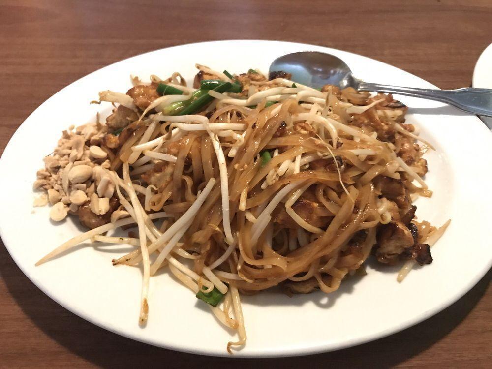 Pad Thai · Stir-fried thin rice noodles with ground peanuts, tofu, egg, scallions and bean sprouts.