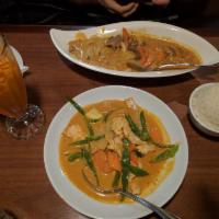 House Curry · Zucchini, bamboo shoots, green beans, bell peppers and basil in choice of red or green curry...