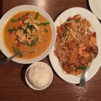 Panang Curry · Bell peppers, green beans and sweet basil in red panang curry sauce. Served with a bowl of r...