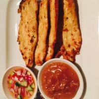 Chicken Satay · Grilled chicken satay, served with peanut sauce and cucumber salad.