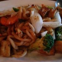 Udon Pad Kee Mao · Stir-fried udon noodles with chili, vegetables and sweet basil.