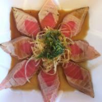 Tuna Tataki · Lightly sear fresh tuna served with sesame flavor chili garlic and ponzu sauce.