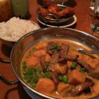 Yellow Curry · Sweet potato, green peas and coconut milk in yellow curry paste. Gluten free. Vegan.