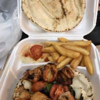 Chicken Kabob Plate · Tender chunks of marinated chicken, comes with 2 side orders and pita bread.
