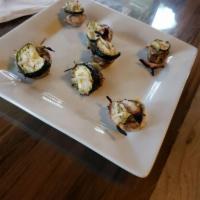 Vegan Stuffed Mushrooms · Organic mushrooms stuffed with garlic, artichokes, spinach, and zucchini. Then topped with v...