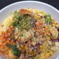 Samosa Chaat · A fried pastry with a savory potato filling.