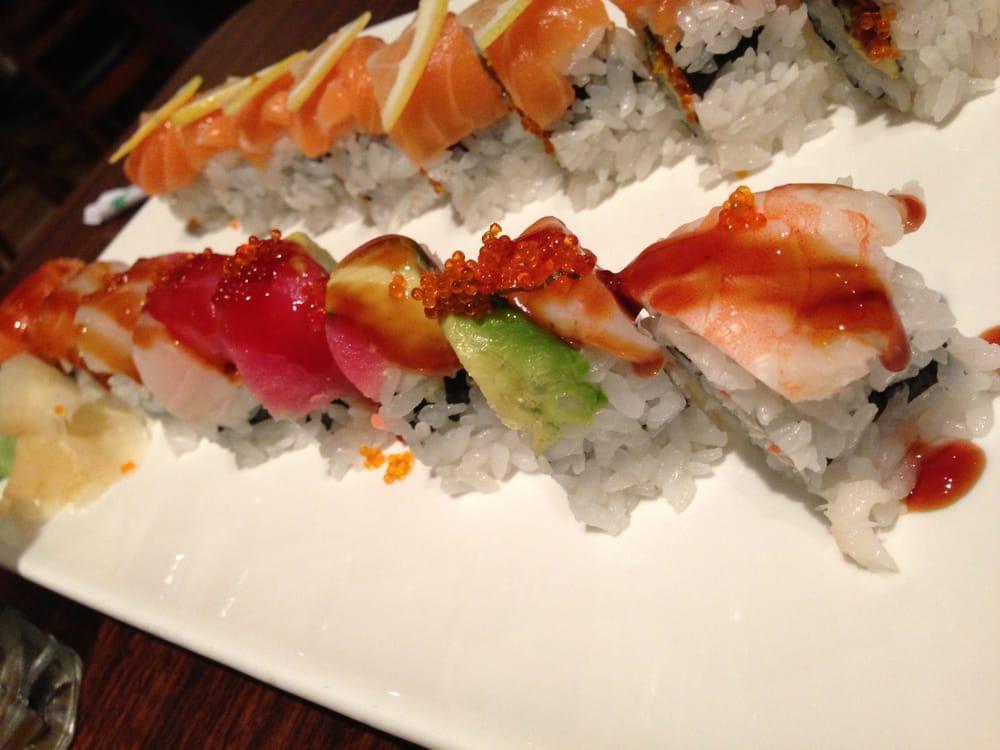 Rainbow Roll · Imitation crab meat, avocado roll topped with tuna, salmon, ebi, hamachi and tai.