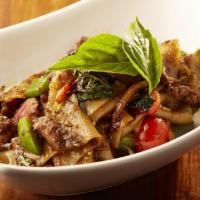 Drunken Noodles · Fresh jasmine rice flat noodles, spicy chopped tenderloin, bell peppers, lettuce and Thai ba...