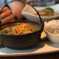 Iron Pot Green Curry Chicken · Chicken breast, scratch green curry, apple eggplant, carrots and rice noodles or jasmine rice.