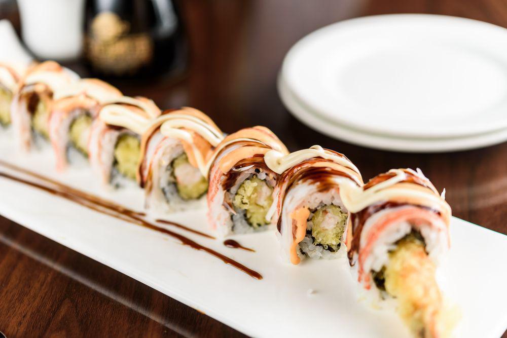 Shaggy Dog Roll · Shrimp tempura inside, topped with shredded crab meat, Japanese mayo, spicy mayo and eel sauce.