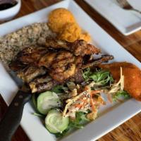 Maga Lahi · BBQ chicken, pork ribs, chicken kelaguen and 1 empanada paired with rice and green salad.