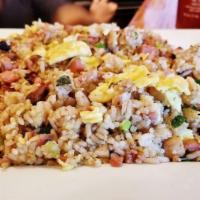 Chamorro Fried Rice · White rice, soy sauce, garlic, onions and 1 choice of meat. Meat choices: chicken, spam, Por...