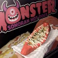 Monster Dog · Foot long bacon wrapped hot dog with tender Birria on top, finished with freshly chopped cil...