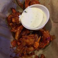 Asian Buffalo Shrimp · Golden brown crispy jumbo butterflied shrimp fried and tossed in our handmade spicy Asian sa...