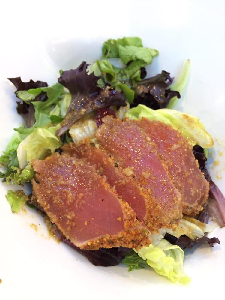 Tuna Tataki Salad · Lightly seared tuna with cucumber and spring mix with sesame ginger dressing.