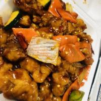 Orange Chicken · Battered and cooked in a sweet orange sauce. Spicy.