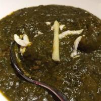 Lamb Saag · Tender cubes of lamb cooked in chopped creamy spinach and mild spices. Served with basmati r...