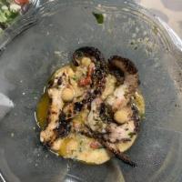 Grilled Octopus · Served with a chick pea and roasted red pepper salad and chick pea spread