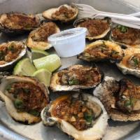Roasted Oysters · Green onions, chili flakes, and roasted garlic.
