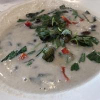 Coconut Snails · Sea snails simmered in coconut cream broth.