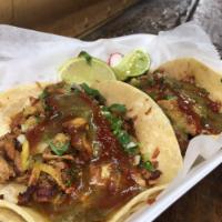 Al Pastor Taco · (1) Spicy pork with pineapple. Made on double corn tortilla with cilantro, onions, radishes ...