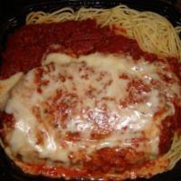 Chicken Parmigiana · A tender, juicy free range chicken breast, breaded and smothered in marinara sauce. Served w...
