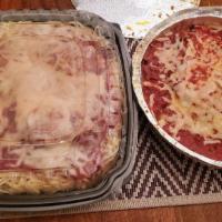 Lasagna · Layer upon layer of thick pasta noodles, ricotta, mozzarella, white cheddar and Parmesan che...