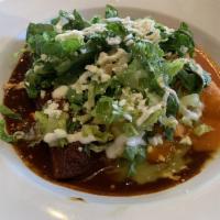Enchiladas · Scallops and shrimp with mole verde.