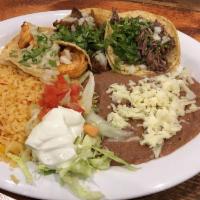Taco Platter · 3 tacos with choice of meat. Served with Spanish rice and refried beans.