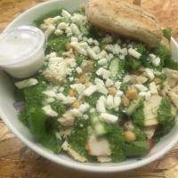 Pesto Chicken Salad · Grilled chicken breast, spinach, chick peas, basil pesto, red onions, tomatoes, feta and cuc...